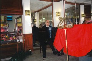 Ted Springett playing piano during the 10th anniversary celebrations of Springett's Arcade in 1994.